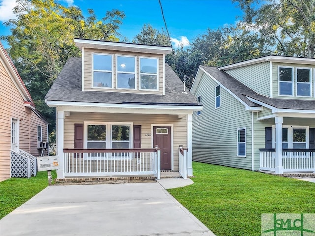 view of front of property with a front lawn and covered porch