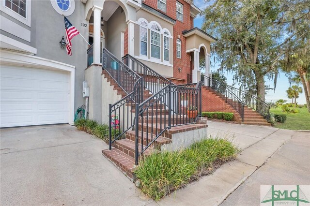 doorway to property featuring a garage