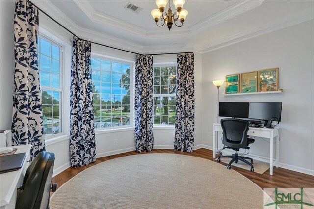 home office featuring hardwood / wood-style flooring, an inviting chandelier, and a healthy amount of sunlight