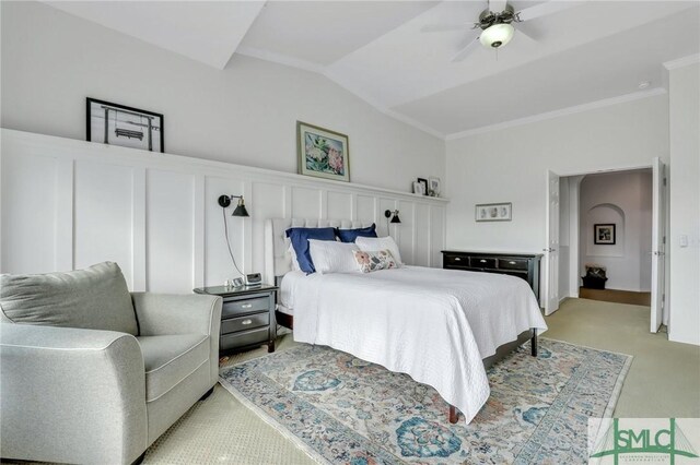 bedroom with light colored carpet, vaulted ceiling, and ceiling fan