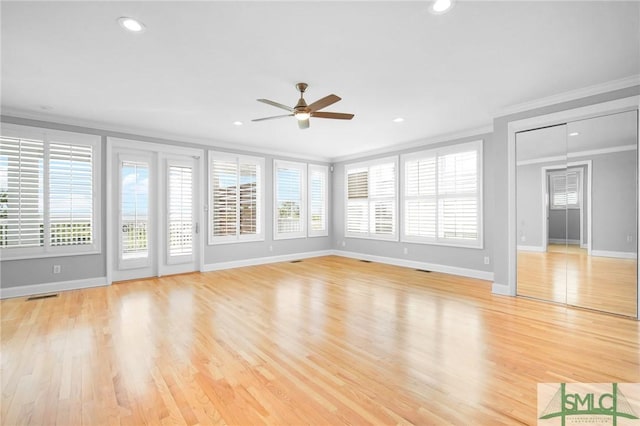 interior space with ceiling fan