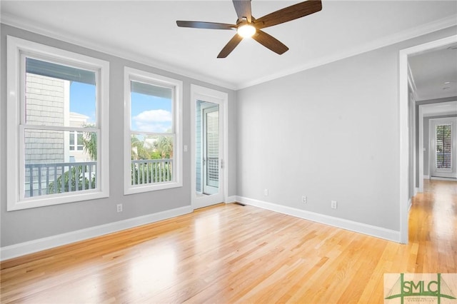 empty room featuring light hardwood / wood-style floors, ceiling fan, and ornamental molding