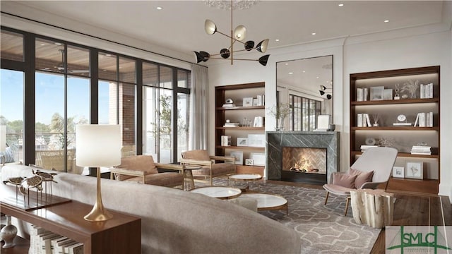 living area with a premium fireplace, wood-type flooring, a chandelier, and built in shelves