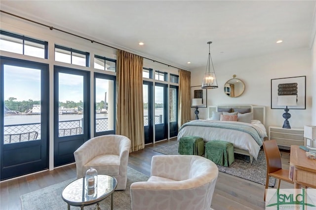 bedroom with access to exterior and light wood-type flooring