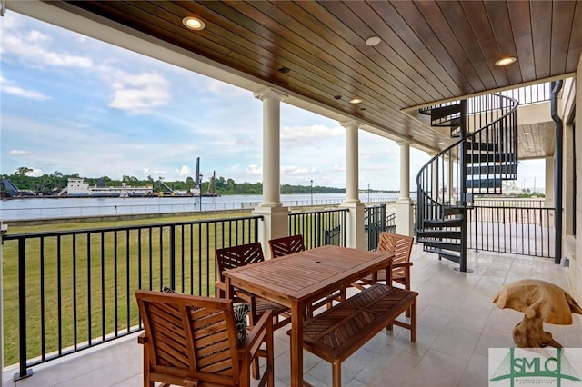 view of patio / terrace with a water view