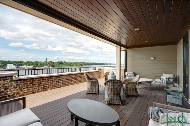 wooden deck with an outdoor hangout area