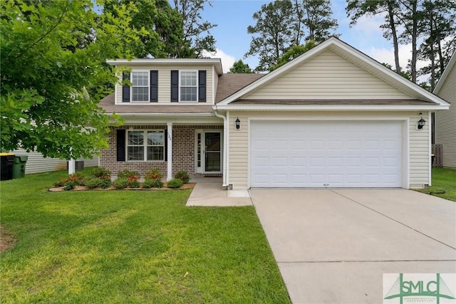 view of front of home with a front yard and a garage