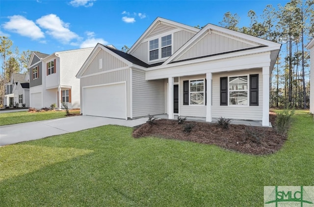 view of front of property featuring a garage and a front yard