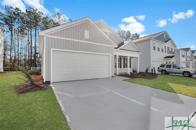 view of front of property with a garage and a front lawn