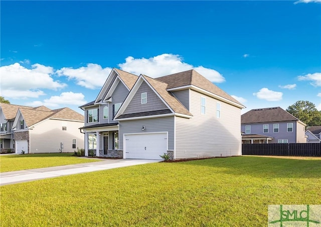 view of front of home with a garage and a front lawn