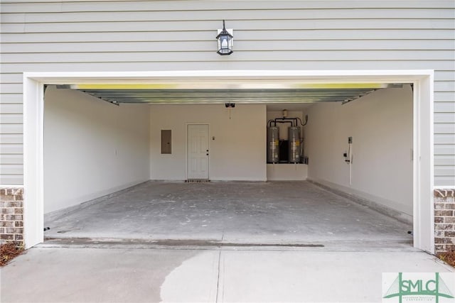 12 Cottonfield Dr, Guyton, GA 31312 - garage with electric panel and electric water heater