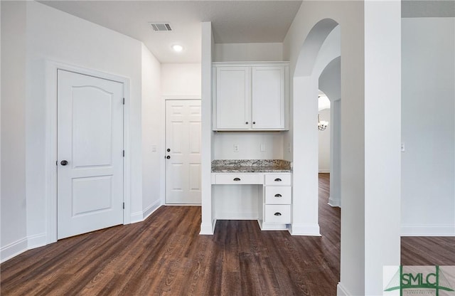 unfurnished office featuring dark hardwood / wood-style flooring