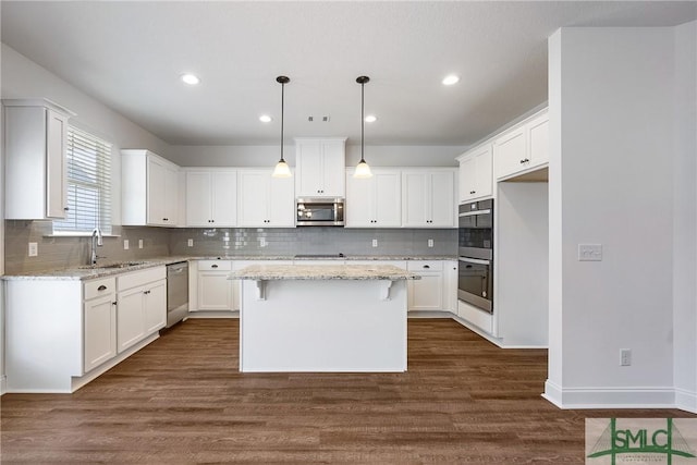 12 Cottonfield Dr, Guyton, GA 31312 - kitchen featuring stainless steel appliances, decorative backsplash, white cabinetry, and recessed lighting