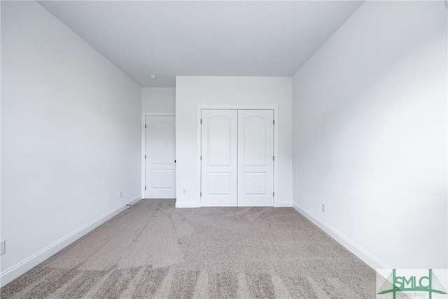 12 Cottonfield Dr, Guyton, GA 31312 - unfurnished bedroom with carpet and a closet