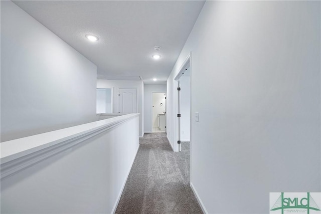 12 Cottonfield Dr, Guyton, GA 31312 - hallway featuring dark carpet, recessed lighting, and an upstairs landing