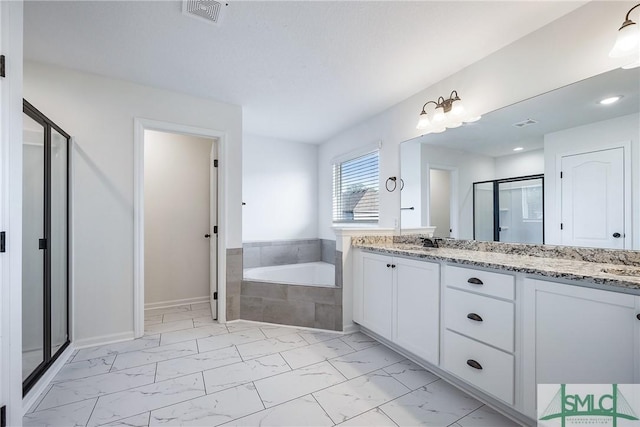 12 Cottonfield Dr, Guyton, GA 31312 - full bath with marble finish flooring, double vanity, a garden tub, and a shower stall
