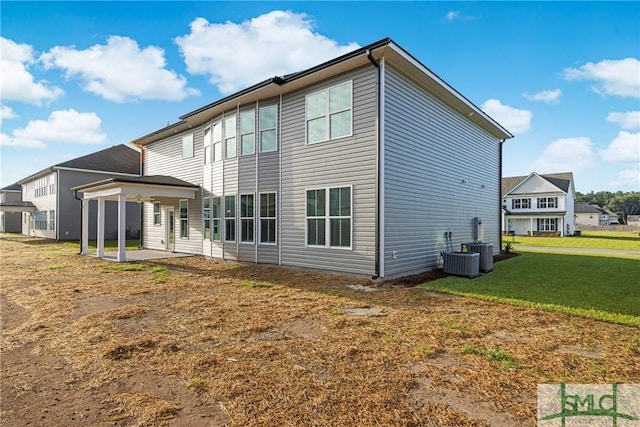 12 Cottonfield Dr, Guyton, GA 31312 - back of property with a patio area and a yard