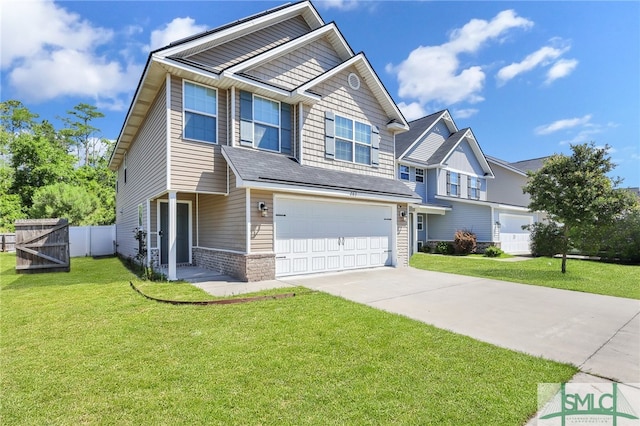 view of front facade with a garage and a front yard