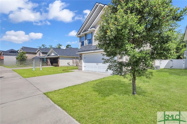 view of front facade with a garage and a front yard