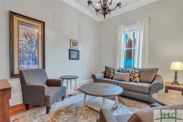 living room featuring light hardwood / wood-style floors, crown molding, and a notable chandelier