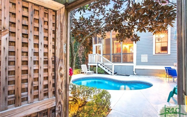 view of swimming pool with a patio