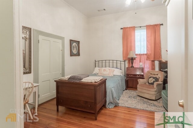 bedroom featuring hardwood / wood-style floors