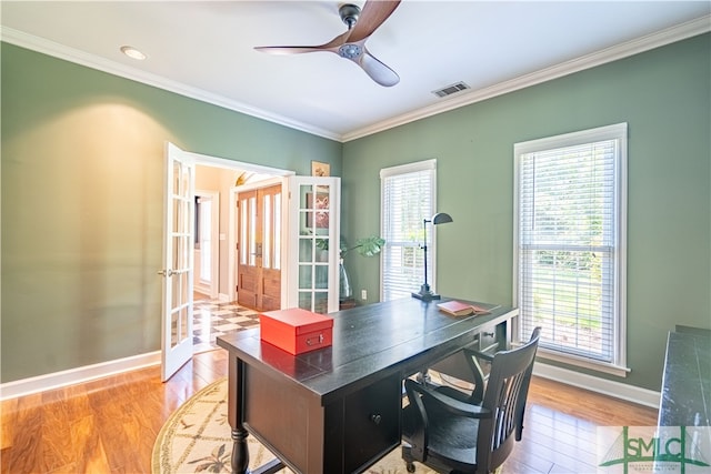 office with ceiling fan, light wood-type flooring, crown molding, and french doors