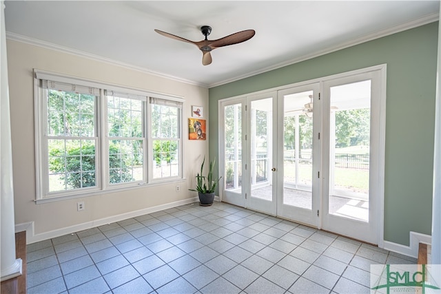 entryway featuring french doors, crown molding, and a healthy amount of sunlight