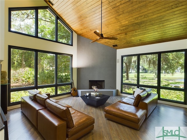 sunroom / solarium featuring ceiling fan, wood ceiling, and vaulted ceiling