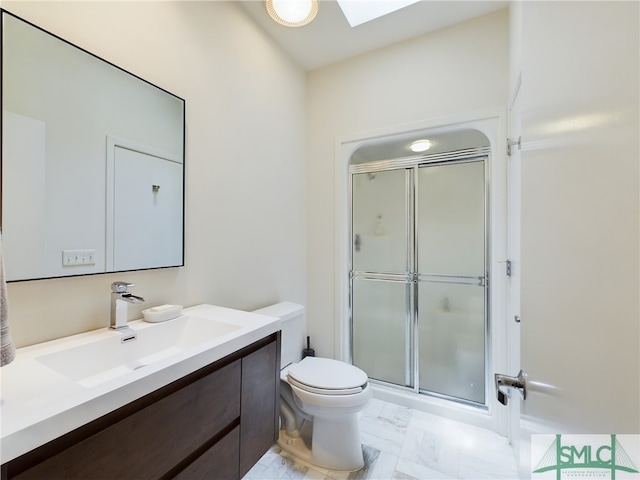 bathroom featuring vanity, toilet, and walk in shower