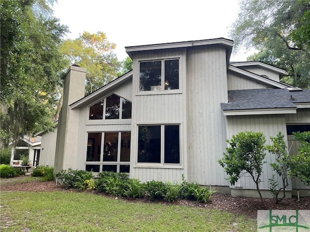 view of side of home featuring a lawn