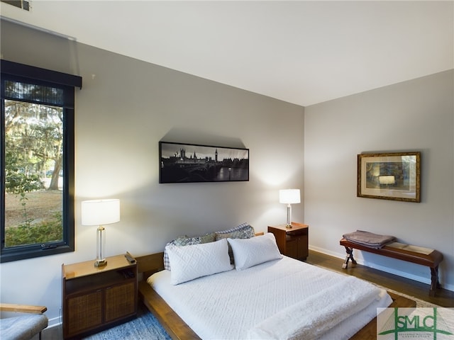 bedroom with wood-type flooring