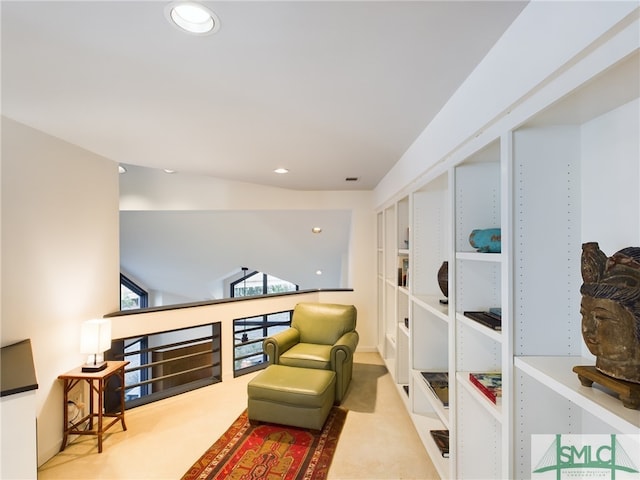 living area featuring light colored carpet