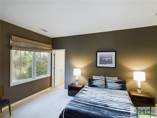 bedroom featuring light colored carpet