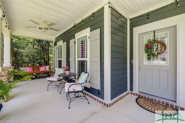 view of patio / terrace featuring ceiling fan