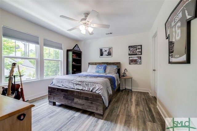 bedroom featuring ceiling fan and wood-type flooring