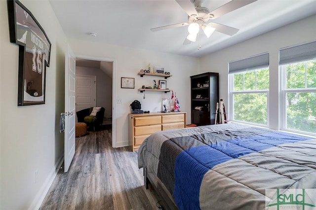 bedroom featuring dark hardwood / wood-style floors and ceiling fan