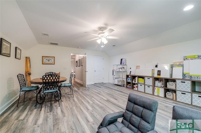 interior space featuring ceiling fan, light hardwood / wood-style floors, and vaulted ceiling