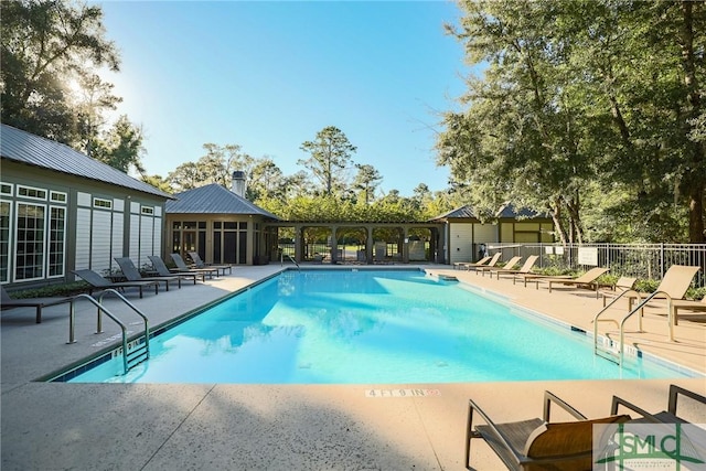 view of swimming pool featuring a patio