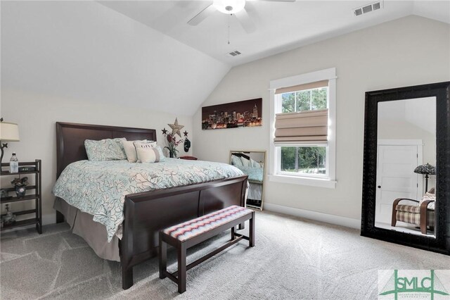 bedroom with ceiling fan, carpet floors, and vaulted ceiling