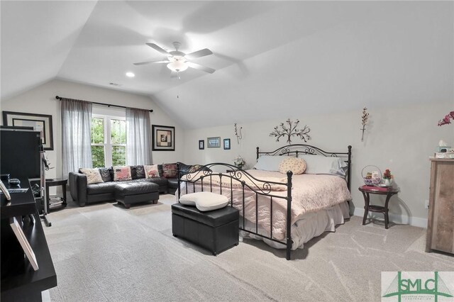 bedroom featuring ceiling fan, light carpet, and vaulted ceiling