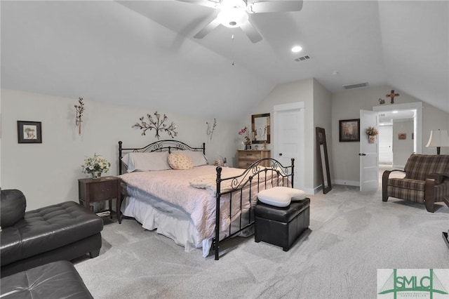 bedroom with ceiling fan, light colored carpet, and lofted ceiling