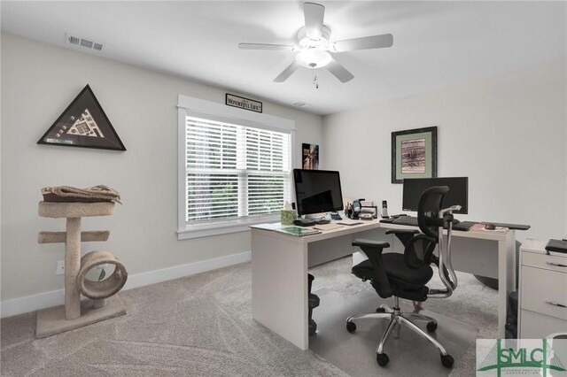 office featuring light carpet and ceiling fan