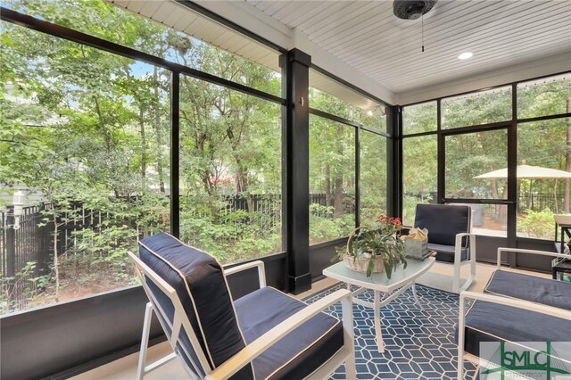 sunroom with a wealth of natural light and wooden ceiling