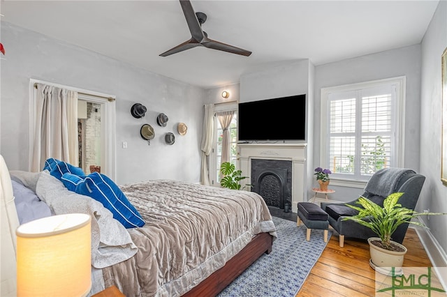 bedroom featuring hardwood / wood-style floors and ceiling fan