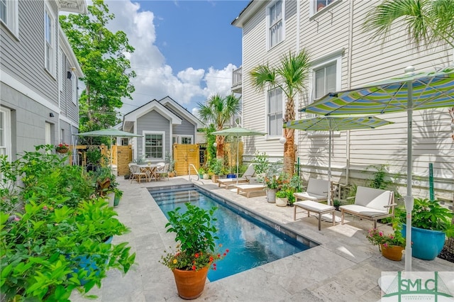 view of swimming pool featuring a patio