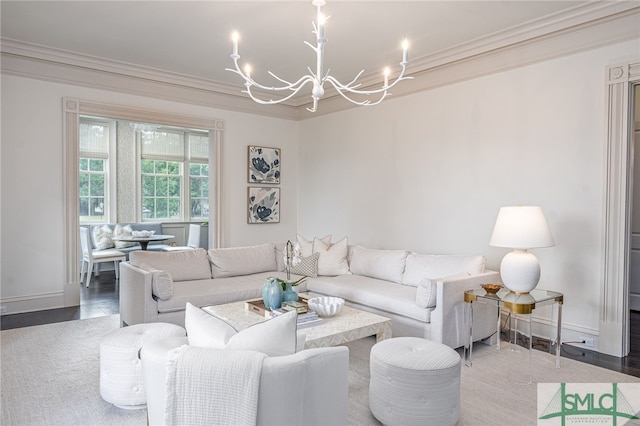 living room featuring a chandelier, hardwood / wood-style floors, and crown molding