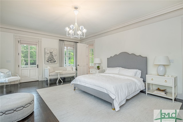 bedroom with wood-type flooring, an inviting chandelier, and crown molding