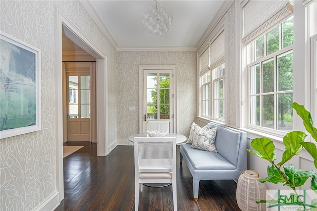 sunroom / solarium with a wealth of natural light and a notable chandelier