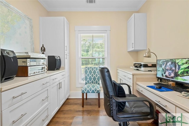 office space with hardwood / wood-style flooring and ornamental molding